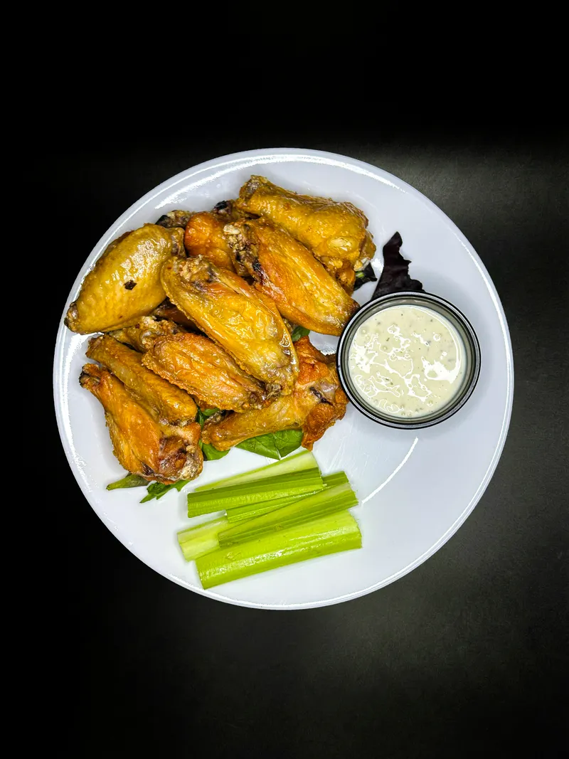Baked wings with celery and ranch at Macarena's Kitchen