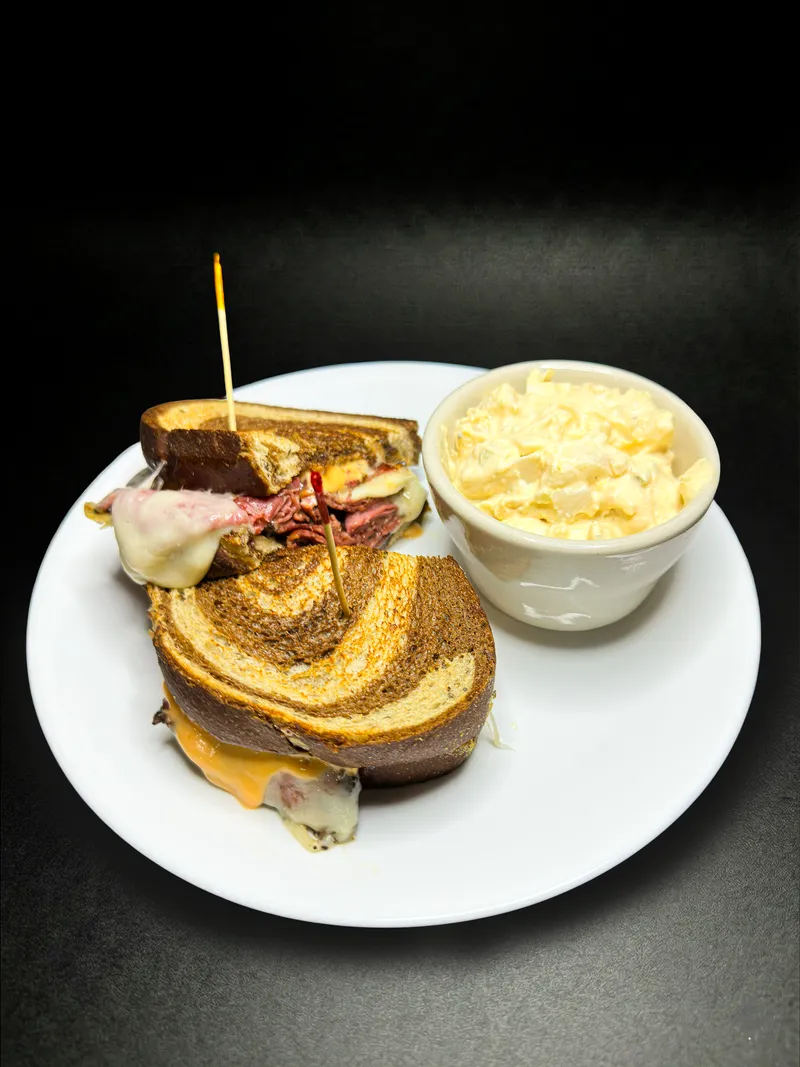 Reuben sandwich with potato salad at Macarena's Kitchen